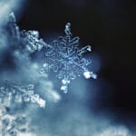 An individual snowflake representing below-freezing temperatures that can lead to frozen pipes in a Charlottesville, VA home.