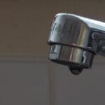 Faucet dripping in home requiring a plumber call to fix.